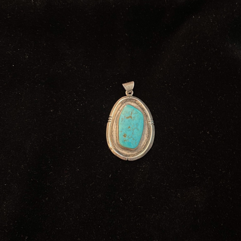 Vintage silver and turquoise pendant. 2 1/2”   Long 1 3/4 wide.